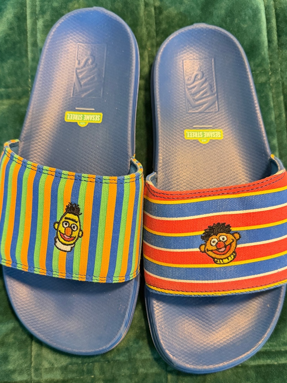 Vans Menโs Blue Slide Sandals with Multicolor Striped Sesame Street Characters